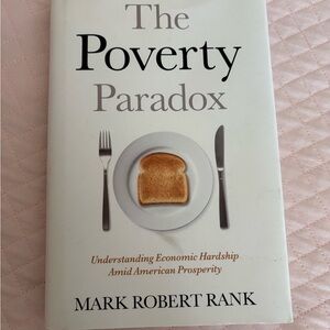 The Poverty Paradox by - White Cover